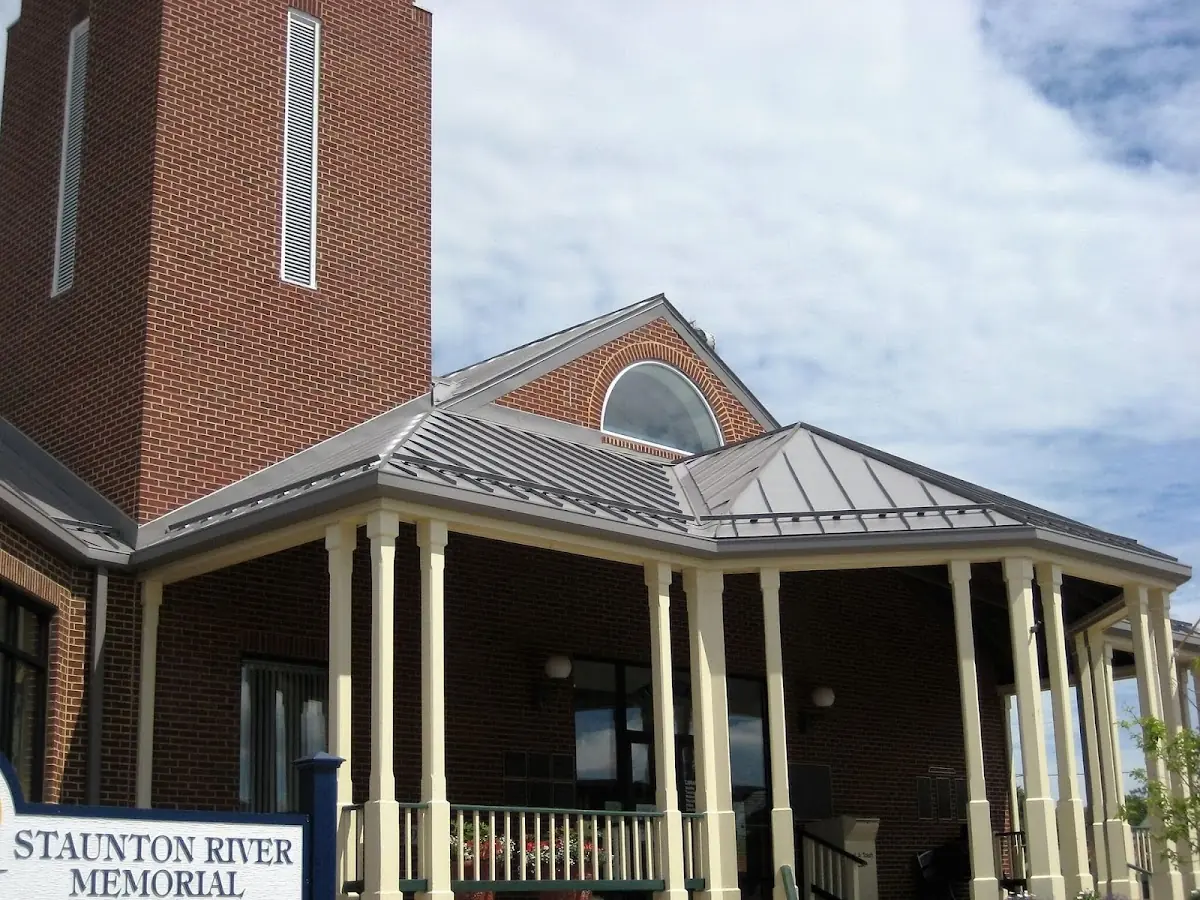 Skilled roofing craftsmen working on a residential roof in Quintette
